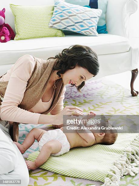 mother and baby - son massage mom imagens e fotografias de stock