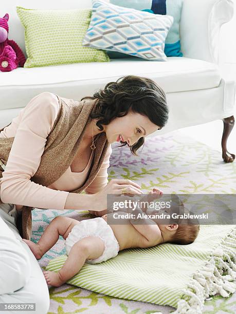 mother and baby - massage boy bildbanksfoton och bilder