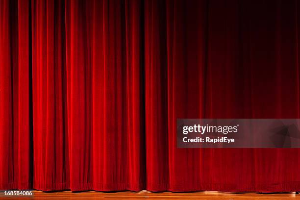 closed red curtains over theater stage - draped cloth stock pictures, royalty-free photos & images