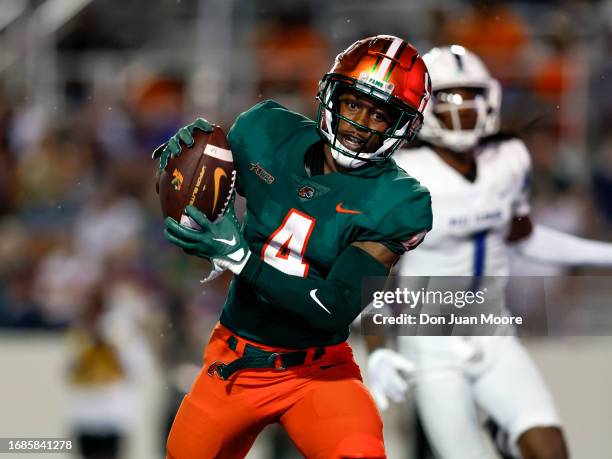 Wide Receiver Marcus Riley of the Florida A&M Rattlers scores a touchdown against the West Florida Argonauts during the game at Bragg Memorial...