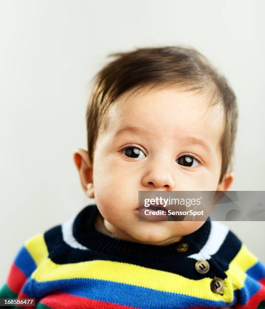 baby boy paying attention - brown eyes stock pictures, royalty-free photos & images
