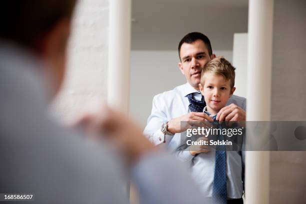 father teaching son to tie a tie - tying up stock pictures, royalty-free photos & images