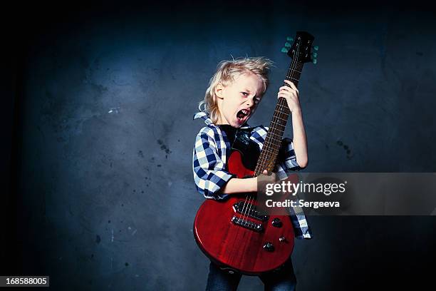 boy rock musician - minirock stock pictures, royalty-free photos & images