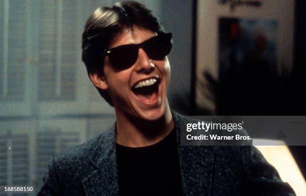 Tom Cruise laughs in a scene from the film 'Risky Business', 1983.