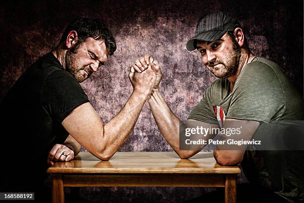 no contest - arm wrestle stock pictures, royalty-free photos & images