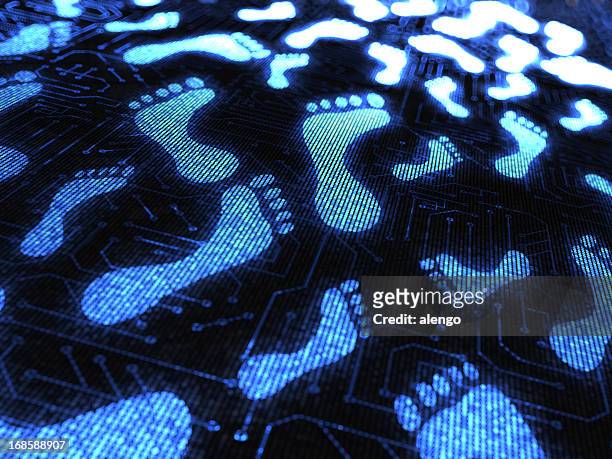 blue footprints over a circuit board - footprint stock pictures, royalty-free photos & images