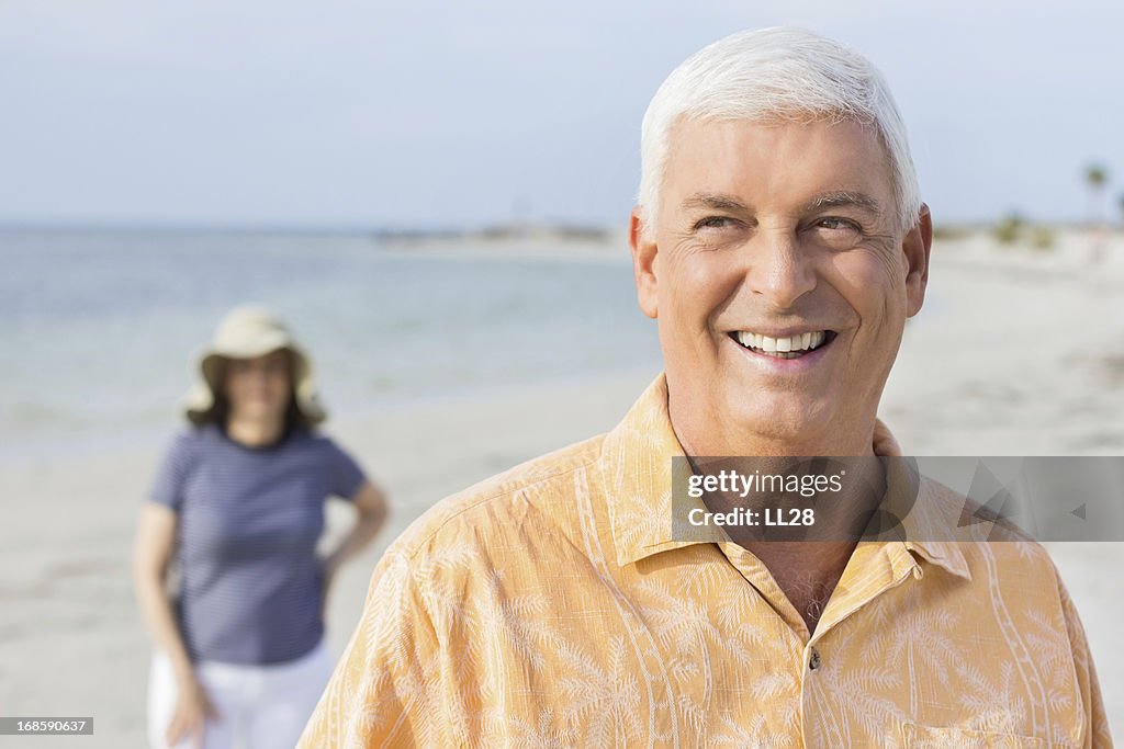 Happy Senior Man With Woman At Beach.