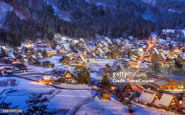 shirakawago light-up with snowfall gifu chubu japan - shirakawa go stock pictures, royalty-free photos & images