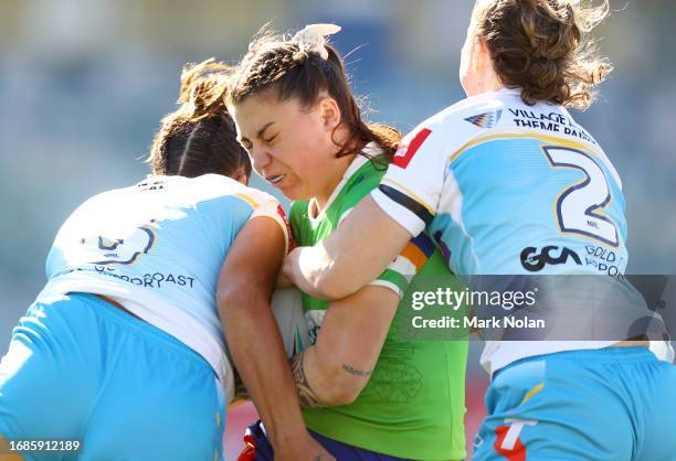 Madison Bartlett of the Raiders is tackled during the round nine NRLW match between Canberra Raiders and Gold Coast Titans at GIO Stadium, on...