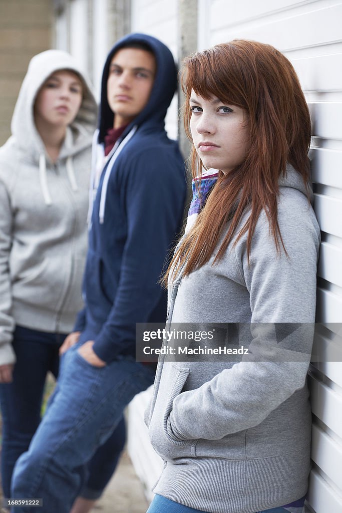 Gang Of Teenagers Hanging Out In Urban Environment