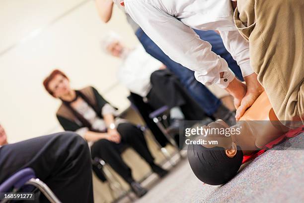 practicing chest compressions - first aid kit stock pictures, royalty-free photos & images