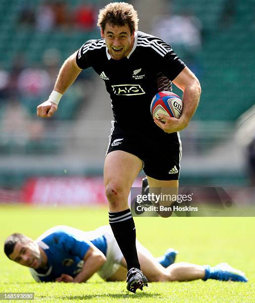 Kurt Baker of New Zealand breaks away from Gaston Revol of Argentina during the Marriott London Sevens - Day Two at Twickenham on May 12, 2013 in...