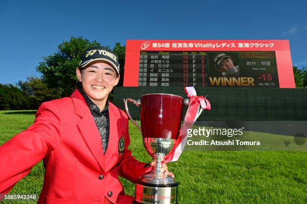 Akie Iwai of Japan imitates the selfie after winning the tournament following the final round of 54th SUMITOMO LIFE Vitality Ladies Tokai Classic at...