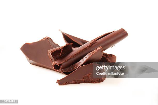 chocolate curls isolated on white - chocolate shaving stock pictures, royalty-free photos & images