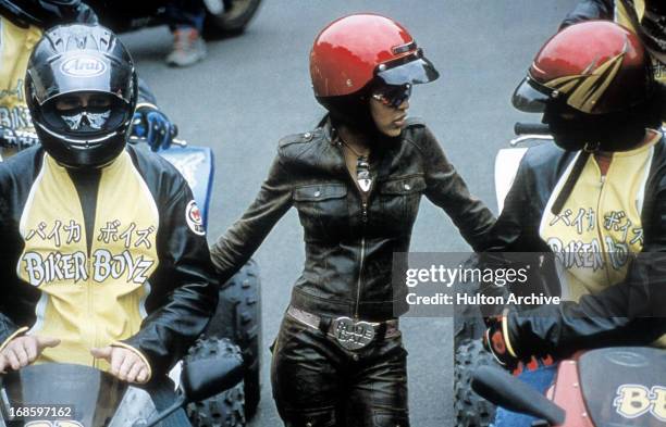 Meagan Good in a red motorcycle helmut in a scene from the film 'Biker Boyz', 2003.