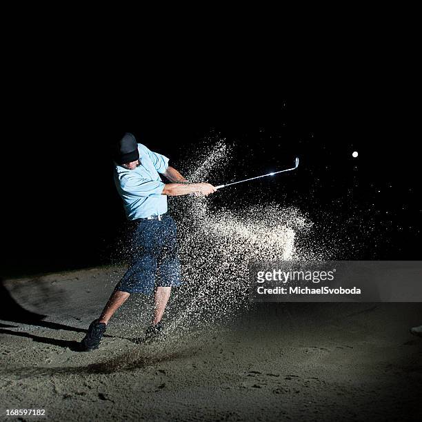 night golfer - golfer swing stock pictures, royalty-free photos & images