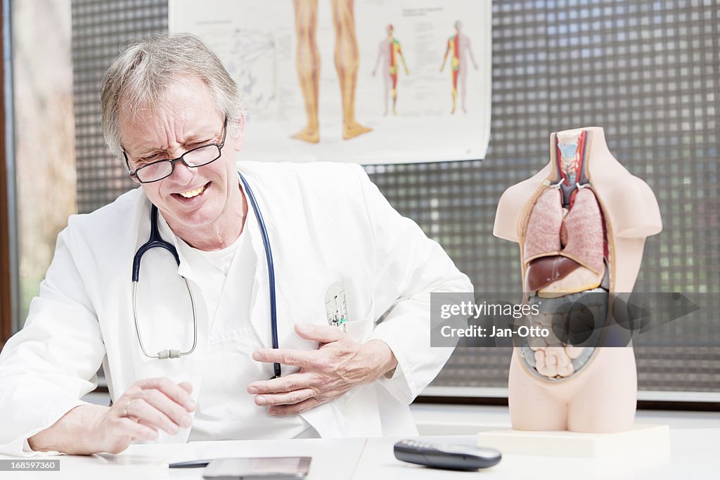 Doctor having heart attack