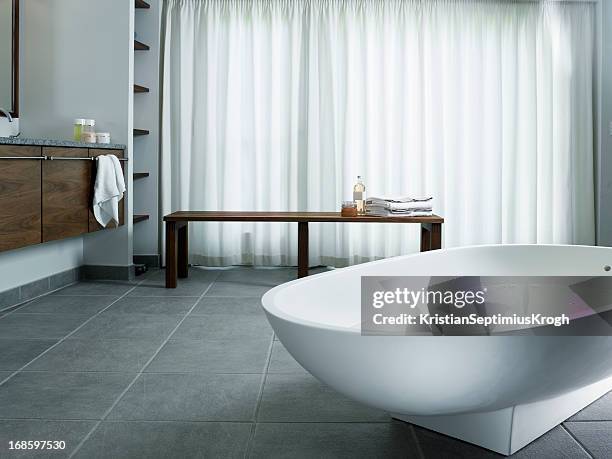 freestanding bathtub - bathroom tiles stock pictures, royalty-free photos & images