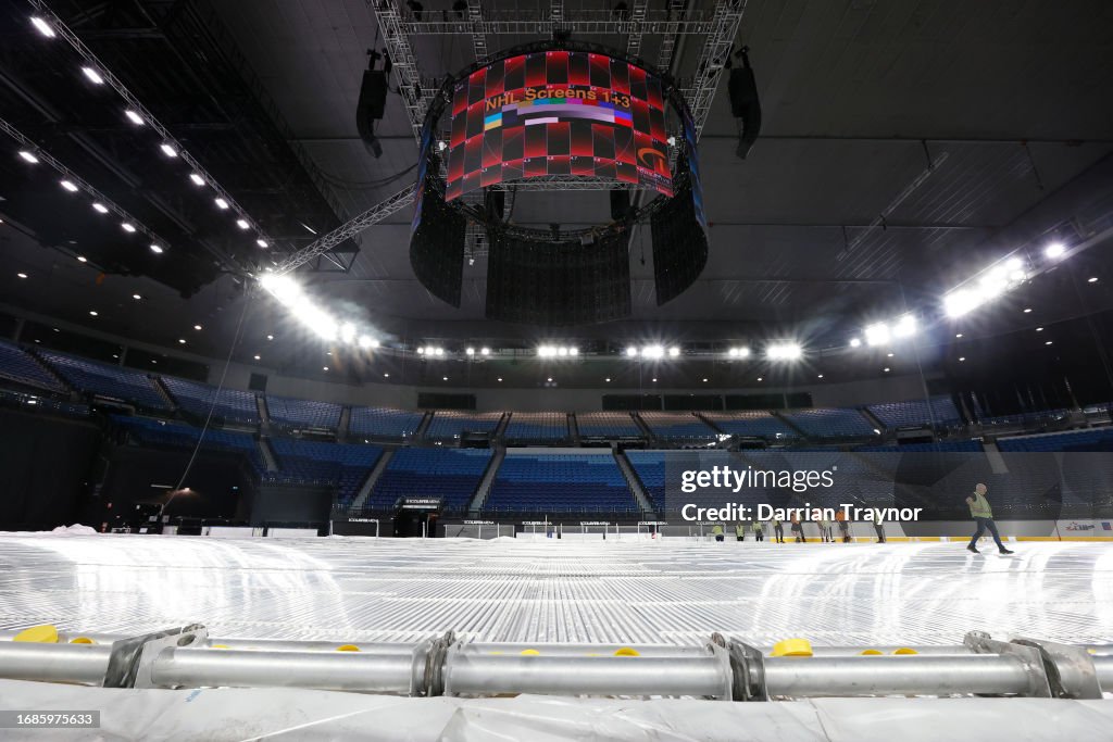 Workers build the ice rink for the NHL Global Series at Rod Laver