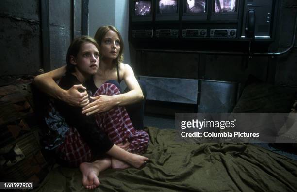 Kristen Stewart is held by Jodie Foster in a scene from the film 'Panic Room', 2002.