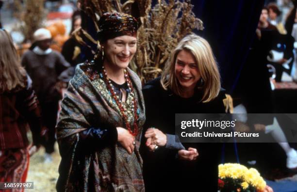 Meryl Streep and Renee Zellweger sharing smiles in a scene from the film 'One True Thing', 1998.