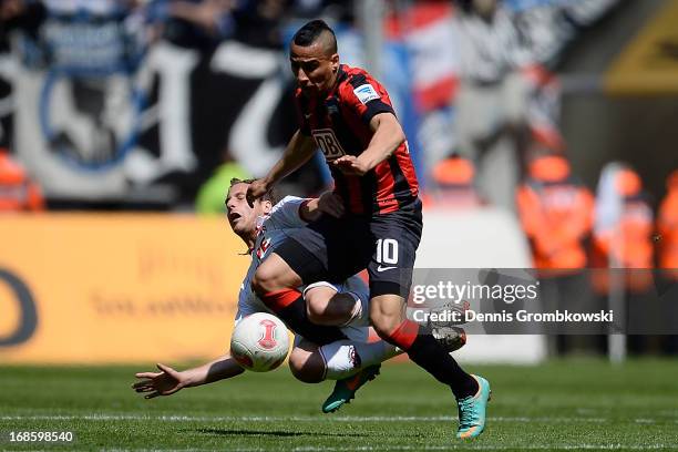 Matthias Lehmann of 1. FC Koeln is challenged by Anis Ben-Hatira of Hertha BSC Berlin during the Second Bundesliga match between 1. FC Koeln and...