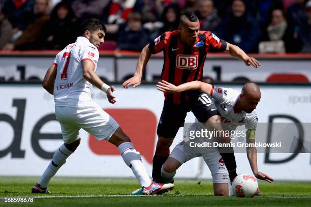 Anis Ben-Hatira of Hertha BSC Berlin is challenged by Miso Brecko of 1. FC Koeln during the Second Bundesliga match between 1. FC Koeln and Hertha...