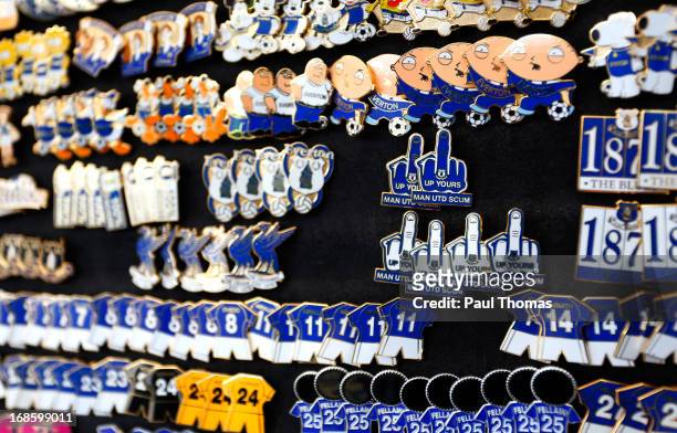 Anti-Manchester United badges on sale outside the ground before the during the Barclays Premier League match between Everton and West Ham United at...