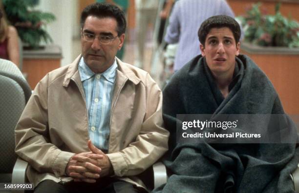 Eugene Levy and Jason Biggs in waiting room in a scene from the film 'American Pie 2', 2001.