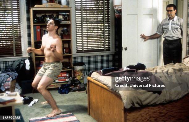 Jason Biggs is caught dancing in his boxers by Eugene Levy in a scene from the film 'American Pie', 1999.