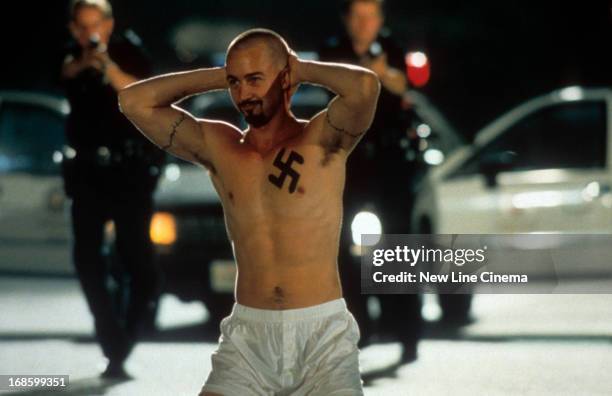 Edward Norton is surrounded by the police in a scene from the film 'American History X', 1998.