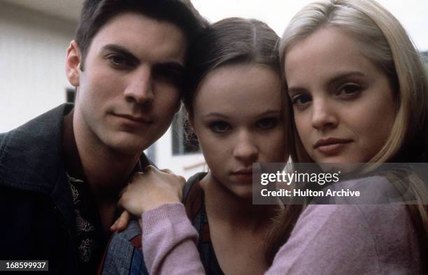 Wes Bentley, Thora Birch and Mena Suvari pose together in a scene from the film 'American Beauty', 1999.