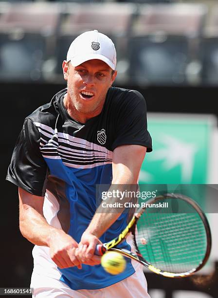 Sam Querrey of the USA plays a backhand against Richard Gasquet of France in their first round match during day one of the Internazionali BNL...