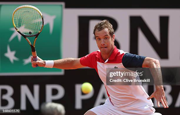 Richard Gasquet of France plays a forehand against Sam Querrey of the USA in their first round match during day one of the Internazionali BNL...