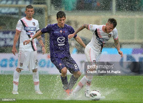 Michel Morganella of Palermo and Stevan Jovetic of Fiorentina compete for the ball during the Serie A match between ACF Fiorentina and US Citta di...