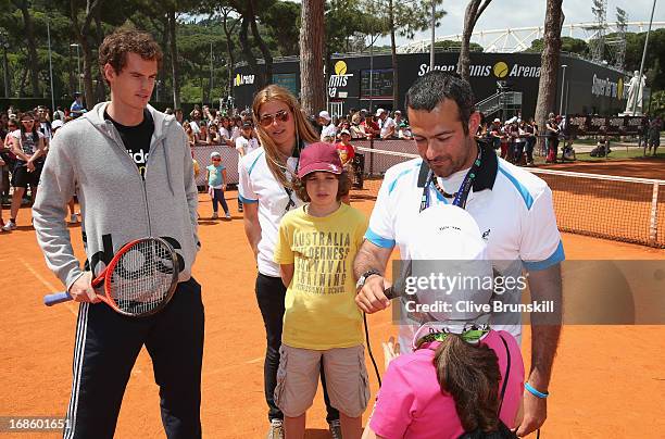 Andy Murray of Great Britain answers young chidrens questions after playing tennis with them during day one of the Internazionali BNL d'Italia 2013...