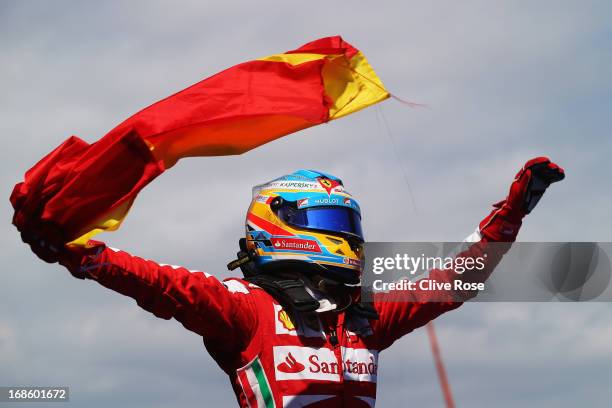 Fernando Alonso of Spain and Ferrari celebrates in parc ferme after winning the Spanish Formula One Grand Prix at the Circuit de Catalunya on May 12,...