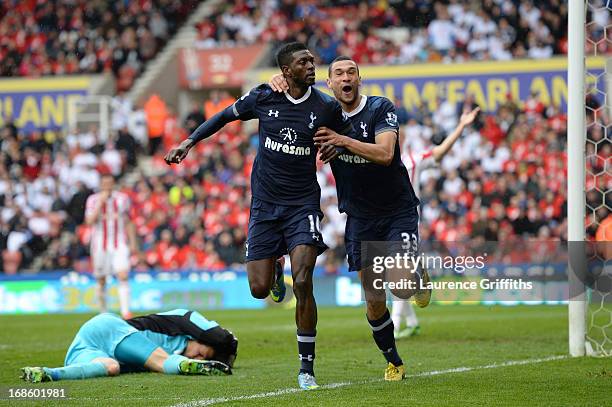 Emmanuel Adebayor of Spurs is congratulated by teammate Steven Caulker after scoring his team's second goal during the Barclays Premier League match...