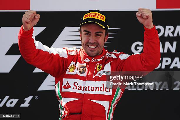 Fernando Alonso of Spain and Ferrari celebrates on the podium after winning the Spanish Formula One Grand Prix at the Circuit de Catalunya on May 12,...