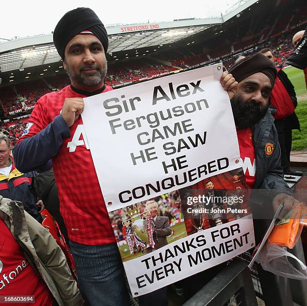 Manchester United fans hold up banners thanking Sir Alex Ferguson ahead of the Barclays Premier League match between Manchester United and Swansea at...