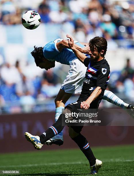 Giuseppe Biava of S.S. Lazio competes for the ball with Jonathan Rossini of UC Sampdoria during the Serie A match between S.S. Lazio and UC Sampdoria...