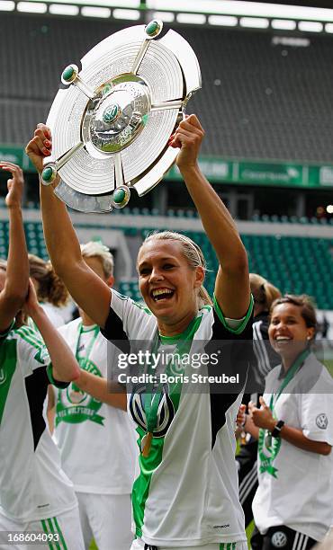 Lena Goessling of Wolfsburg celebrates with the trophy after winning the German Championship after the Women's Bundesliga match between VfL Wolfsburg...