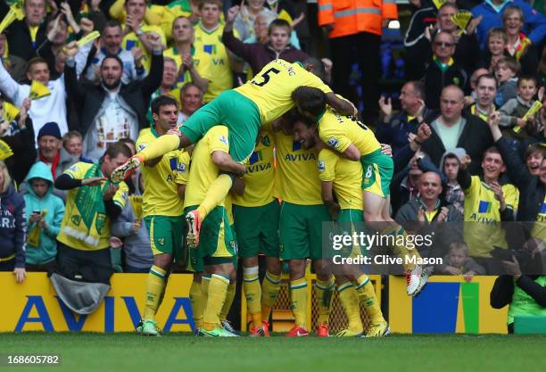 Norwich players celebrate Grant Holts goal during the Barclays Premier League match between Norwich City and West Bromwich Albion at Carrow Road on...