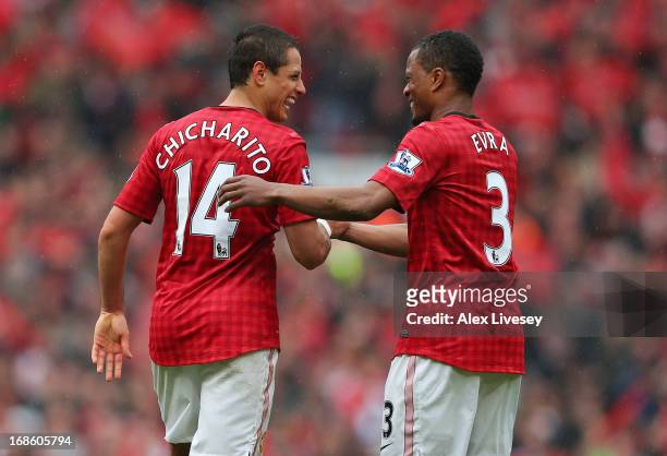 Javier Hernandez of Manchester United is congratulated by team-mate Patrice Evra after scoring the opening goal during the Barclays Premier League...