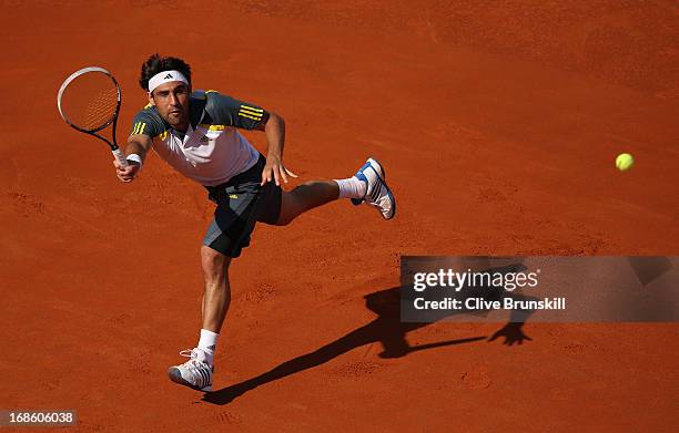 Marcos Baghdatis of Cyprus in action against Grigor Dimitrov of Bulgaria in their first round match during day one of the Internazionali BNL d'Italia...