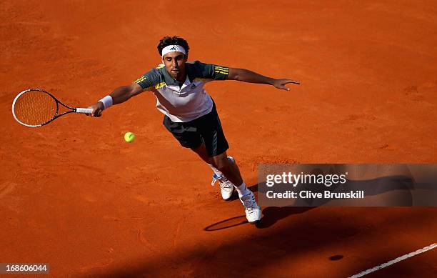 Marcos Baghdatis of Cyprus stretches to play a forehand against Grigor Dimitrov of Bulgaria in their first round match during day one of the...