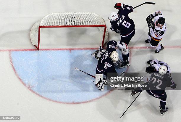 John Gibson , goaltender of USA makes a save on Marcel Noebles of Germany during the IIHF World Championship group H match between USA and Germany at...