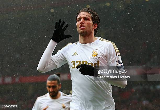 Miguel Michu of Swansea City celebrates scoring his team's first goal to make the score 1-1 during the Barclays Premier League match between...