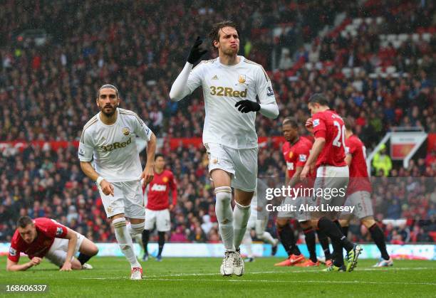 Miguel Michu of Swansea City celebrates scoring his team's first goal to make the score 1-1 during the Barclays Premier League match between...