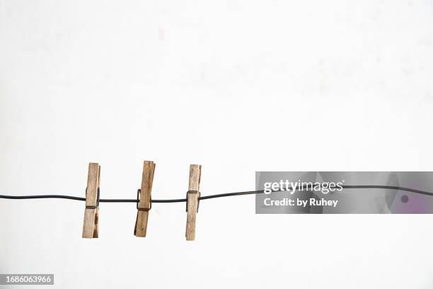 clothesline with clothespins with a white background - clothes peg isolated stock pictures, royalty-free photos & images